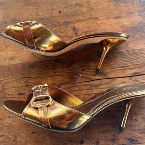 Gucci gold Open-Toe Heeled Sandals with signature gold buckle.